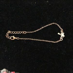 Gold tone bracelet with palm tree